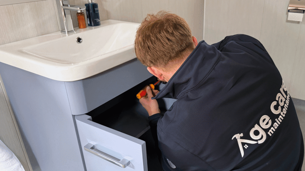 Age Care drainage specialist working on a customer's home